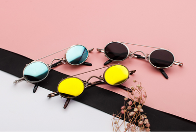 Retro round sunglasses with vibrant red lenses and a black metal frame, featuring a unique flip-up design. - Image 12