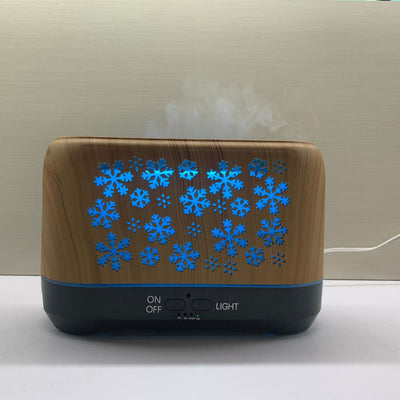 Wood grain humidifier with snowflake pattern, emitting blue flame-like mist, shown with remote control and other color options. - Image 12