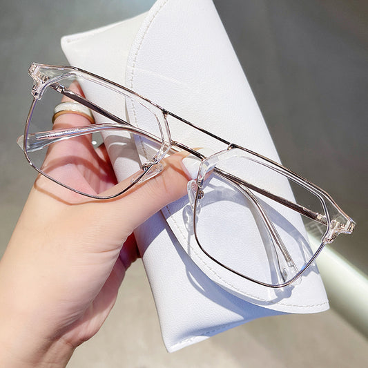 Anti-blue light glasses with a sand black and silver double beam frame, held against a white case. - Image 2