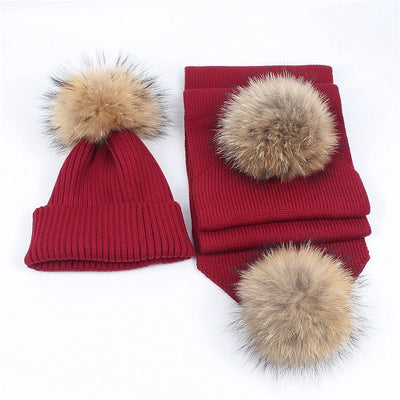 Red knitted hat and scarf set with fluffy brown and black fur pom-poms, ideal for warm winter wear. - Image 4