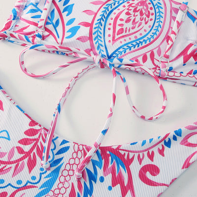 White ribbed two-piece swimsuit with pink and blue paisley floral print, bandeau top, and high-cut bottoms. - Image 14