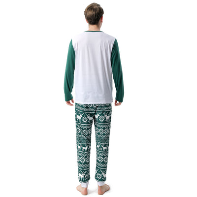 Woman in a Christmas pajama set with a white top, green sleeves, dinosaur graphic, and green fair isle pants. - Image 13