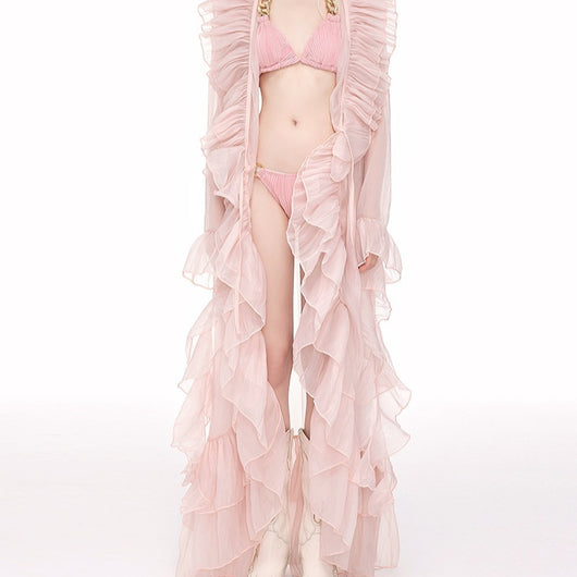 Light pink ruffled sheer swimsuit cover-up blouse over a matching bikini, perfect for beach vacations. - Image 4