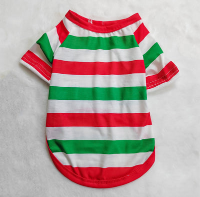 Woman wearing a green, red, and white striped Christmas pajama set with a Santa Claus graphic on the top. - Image 6