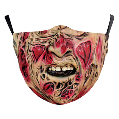 Green and yellow digital print Halloween dust mask with a grotesque, tree-like face design and black ear loops. - Image 15
