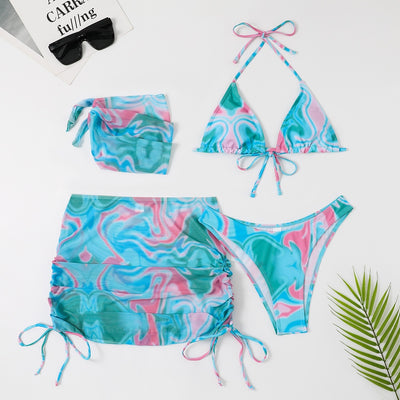 Four-piece tie-dyed bikini swimsuit set in orange, yellow, and white, with a triangle top, high-cut bottoms, ruched mini skirt, and matching headscarf. - Image 43
