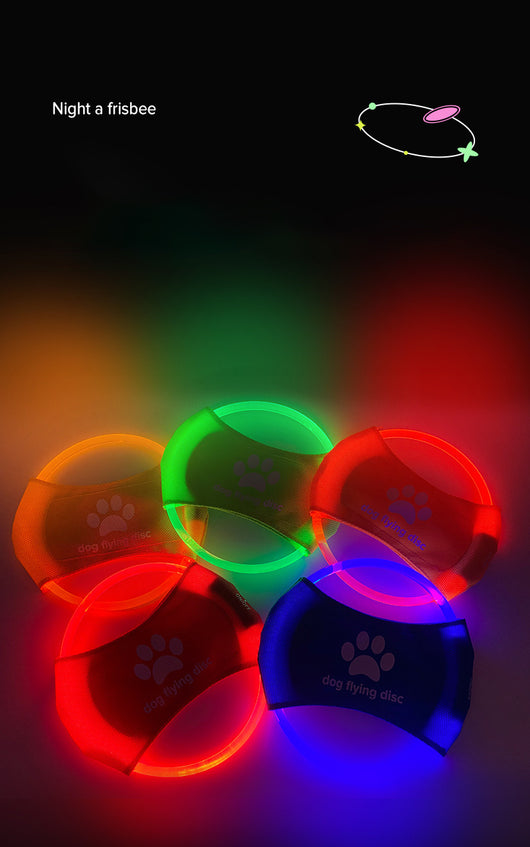 Red LED light-up dog flying disc with a white paw print logo and "dog flying disc" text. - Image 14