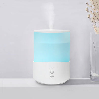 White cylindrical household humidifier with a translucent top section glowing blue, featuring two control buttons.