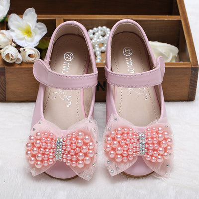 Beige girls' princess shoes with pearl and rhinestone bows, featuring a flat heel and a convenient Velcro strap. - Image 6