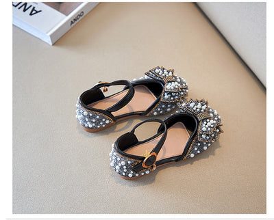Beige girls' shallow mouth pumps with a large pink pearl bow, glitter, and an ankle strap with a gold buckle. - Image 15