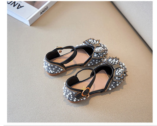 Beige girls' shallow mouth pumps with a large pink pearl bow, glitter, and an ankle strap with a gold buckle. - Image 15