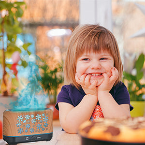 Wood grain humidifier with snowflake pattern, emitting blue flame-like mist, shown with remote control and other color options. - Image 16