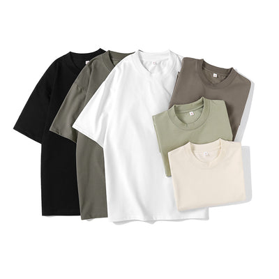Moss green short-sleeve cotton t-shirt with a crew neck and a relaxed, oversized fit.