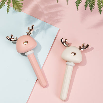 White and clear columnar mini humidifier with a cute bird-shaped top, featuring rose gold beak and tail accents.