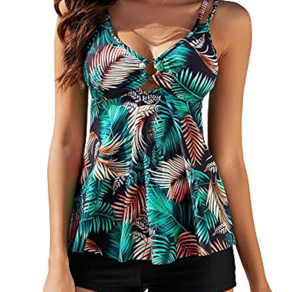 Women's plus size two-piece swimsuit with a red floral print tankini top and black boxer swim shorts.