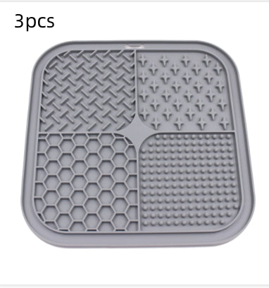 Gray silicone pet licking pad with four textured sections, designed for slow feeding and anti-choking. - Image 20