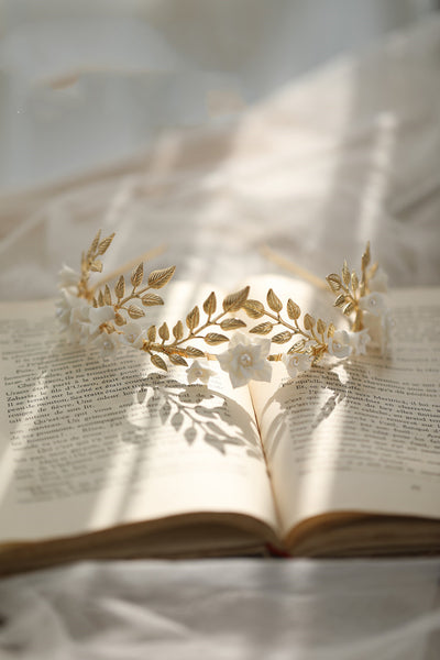 Silver-toned hair band with white ceramic flowers, faux pearls, and delicate silver leaves, perfect for bridal wear. - Image 6