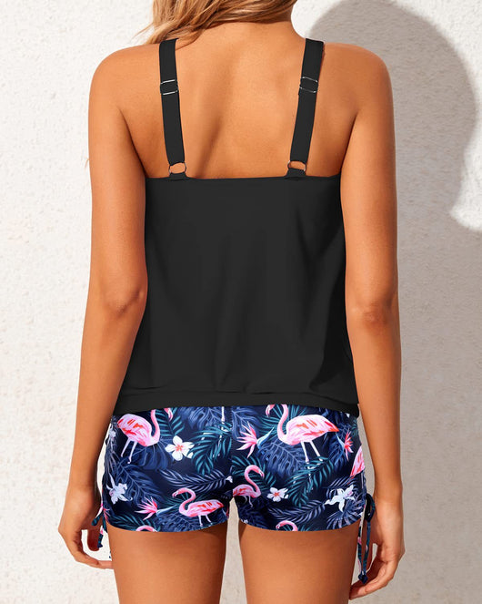 Women's two-piece tankini swimsuit with a colorful abstract print tank top and solid black ruched swim shorts. - Image 24