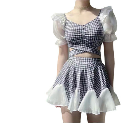 Women's conservative two-piece swimsuit with beige and white houndstooth pattern, sheer puff sleeves, and a flared skirt. - Image 3