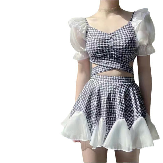 Women's conservative two-piece swimsuit with beige and white houndstooth pattern, sheer puff sleeves, and a flared skirt. - Image 3