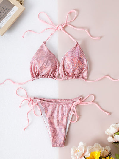 Gold snakeskin print string bikini with black ties, featuring a triangle top and thong bottom, modeled on a person. - Image 6