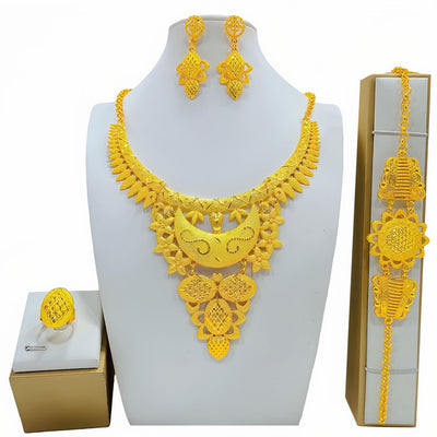 Gold-colored women's jewelry set with ornate floral and filigree designs, including a necklace, drop earrings, bracelet, and ring. - Image 9