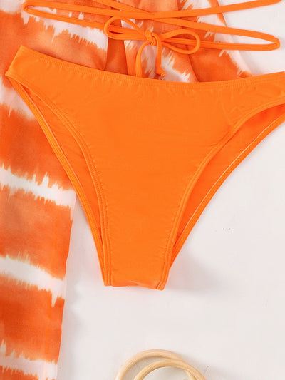 Women's orange and white tie-dye chiffon three-piece swimsuit with a bandeau bikini top and matching bottoms. - Image 4