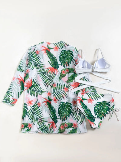 White criss-cross bikini top with high-waisted tropical floral print bottoms and matching long-sleeved cover-up. - Image 6