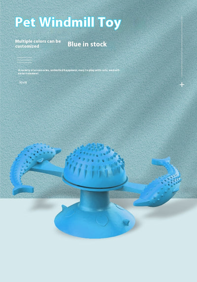 Blue pet toy for cats featuring a spinning windmill design with two dolphin-shaped arms and a suction cup base. - Image 6