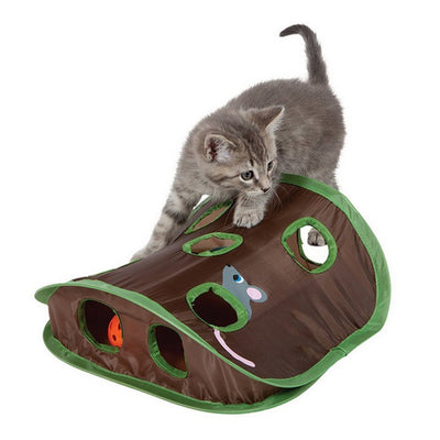 Grey tabby kitten playing with a brown and green hide-and-seek cat toy with multiple holes and a mouse graphic. - Image 4