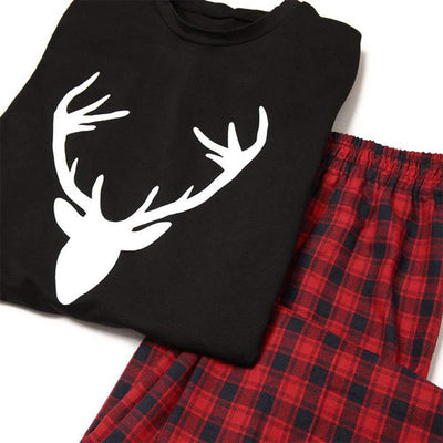 Mom's black long-sleeve pajama top with white deer head print and red and black plaid pajama pants. - Image 12