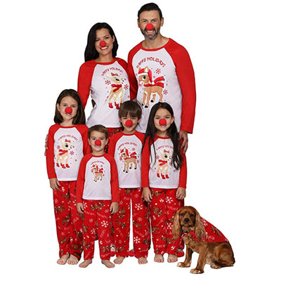 Family of five and a dog wearing matching red and white Christmas pajamas with reindeer and snowflake prints. - Image 11
