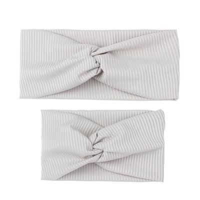 Matching dusty rose ribbed knit headbands with a twisted knot, one for an adult and one for a child. - Image 8