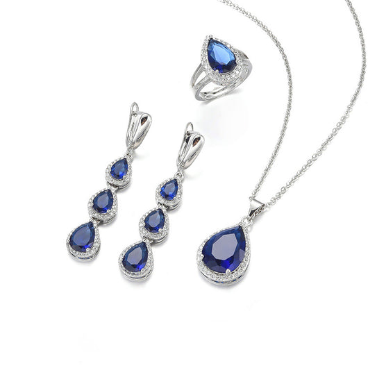 Green pear-shaped gemstone jewelry set with necklace, dangle earrings, ring, and bracelet, all with clear stone accents. - Image 16