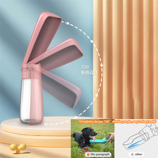 Yellow 450ml portable pet water bottle with a folding drinking trough and white wrist strap, on grass. - Image 20