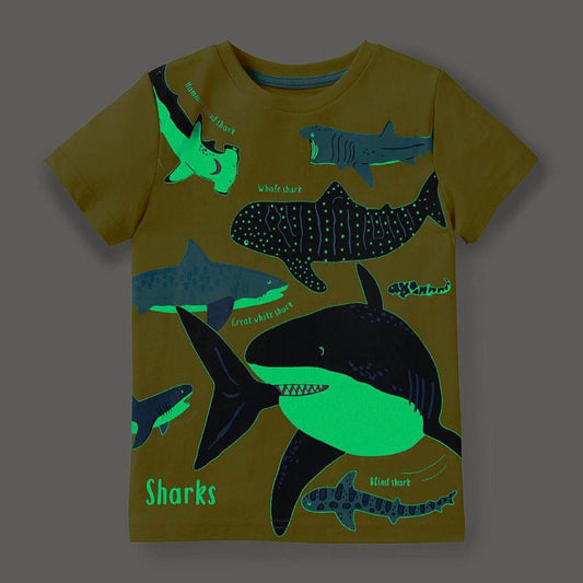 Dark blue short-sleeved children's t-shirt with multiple glowing jellyfish graphics and a yellow neck trim.