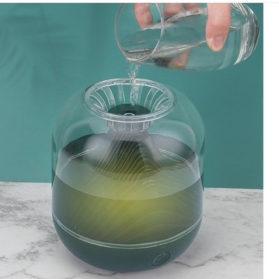 Red USB rechargeable humidifier with a clear dome top and a unique mountain-shaped interior design. - Image 12