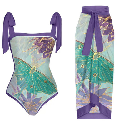 One-piece swimsuit with purple tie-shoulder straps, square neckline, and a teal butterfly and floral print. - Image 10