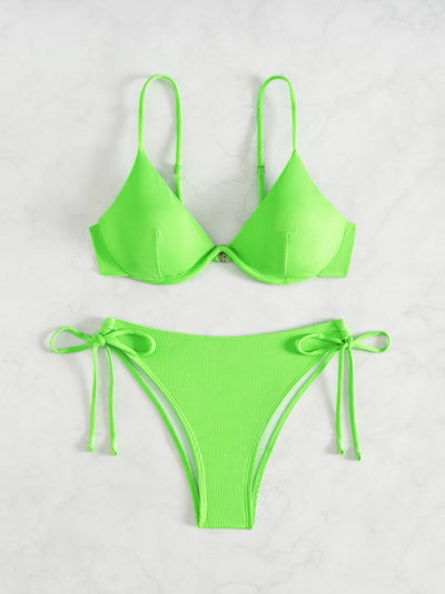 Black ribbed two-piece bikini with an underwire top and tie-side bottoms on a white marble surface. - Image 12