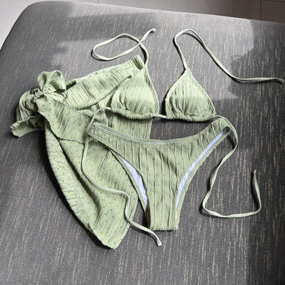 White textured bikini with ruched triangle top, high-cut bottom, and matching sarong with a large bow. - Image 15