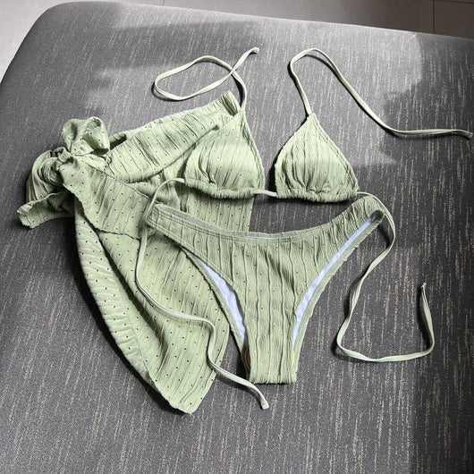 White textured bikini with ruched triangle top, high-cut bottom, and matching sarong with a large bow. - Image 15