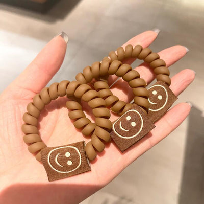 Elástico para Cabello Color Té con Leche Mate con Carita Sonriente - Image 10