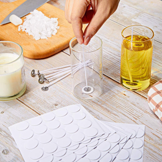 Sheet of 20 round white double-sided adhesive foam stickers for fixing candle wicks or bases.