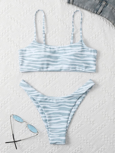 Tan and white zebra stripe two-piece bikini with a bandeau top and high-cut bottom, laid flat. - Image 14