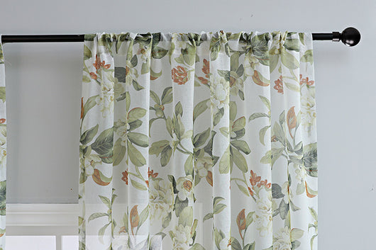 Dark gray semi-sheer curtains with a white and green floral pattern, hung on a black rod in a living room. - Image 14