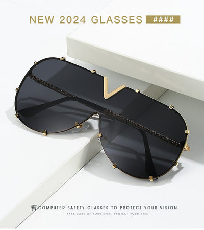 Oversized V-shaped sunglasses with a gold metal frame, white accents, clear lenses, and decorative rivets. - Image 21
