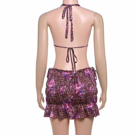 Three-piece bikini set with a brown leopard and pink floral print halter top, matching bottom, and ruched mini skirt. - Image 29