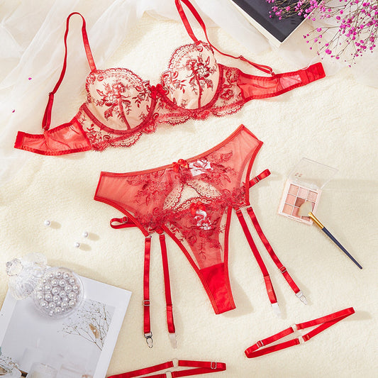 Nude and black embroidered sheer lingerie set with a bra, thong, and garter belt, featuring floral lace. - Image 2