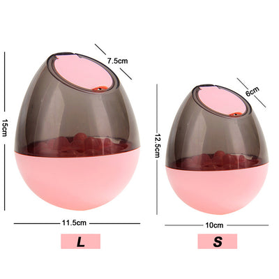 Orange and blue interactive pet food dispenser toy with multiple tiers and white balls, next to its black packaging. - Image 13