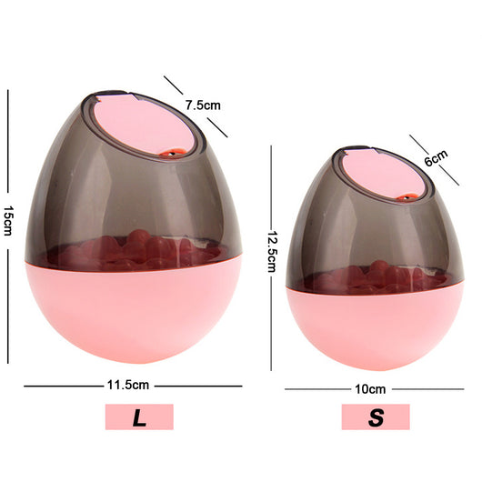 Orange and blue interactive pet food dispenser toy with multiple tiers and white balls, next to its black packaging. - Image 13